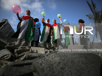 Palestinian children participate in an activity aimed to support the mental health of children affected by the recent Israel-Gaza fighting,...