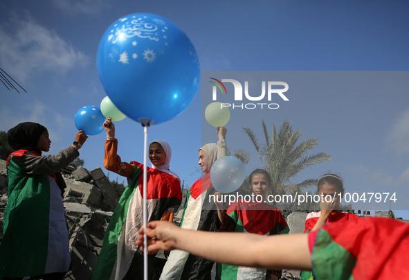 Palestinian children participate in an activity aimed to support the mental health of children affected by the recent Israel-Gaza fighting,...