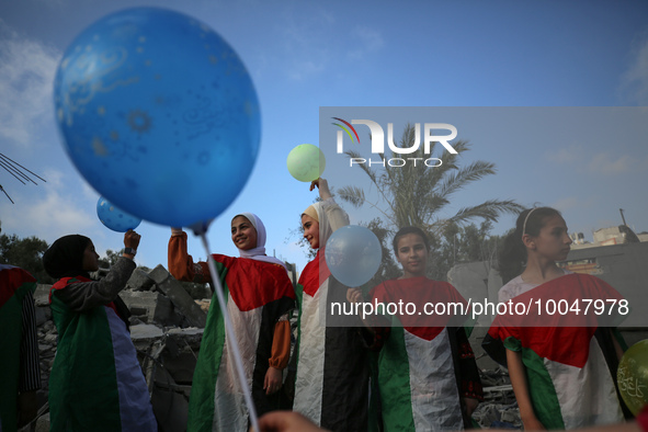 Palestinian children participate in an activity aimed to support the mental health of children affected by the recent Israel-Gaza fighting,...