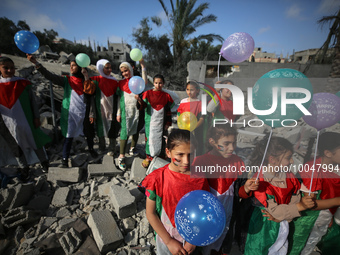 Palestinian children participate in an activity aimed to support the mental health of children affected by the recent Israel-Gaza fighting,...