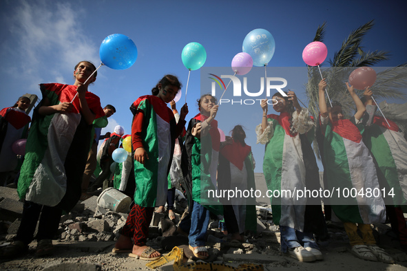 Palestinian children participate in an activity aimed to support the mental health of children affected by the recent Israel-Gaza fighting,...