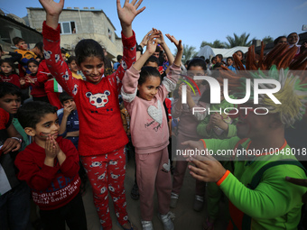 Palestinian children participate in an activity aimed to support the mental health of children affected by the recent Israel-Gaza fighting,...