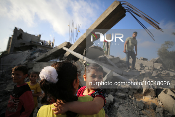 Palestinian children participate in an activity aimed to support the mental health of children affected by the recent Israel-Gaza fighting,...