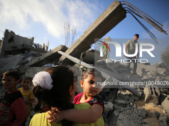 Palestinian children participate in an activity aimed to support the mental health of children affected by the recent Israel-Gaza fighting,...