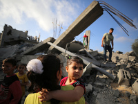 Palestinian children participate in an activity aimed to support the mental health of children affected by the recent Israel-Gaza fighting,...