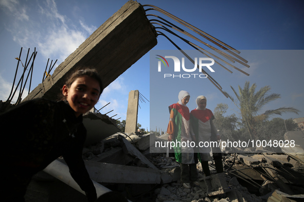 Palestinian children participate in an activity aimed to support the mental health of children affected by the recent Israel-Gaza fighting,...