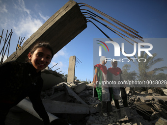 Palestinian children participate in an activity aimed to support the mental health of children affected by the recent Israel-Gaza fighting,...