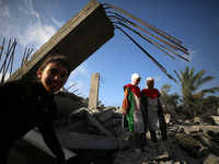 Palestinian children participate in an activity aimed to support the mental health of children affected by the recent Israel-Gaza fighting,...