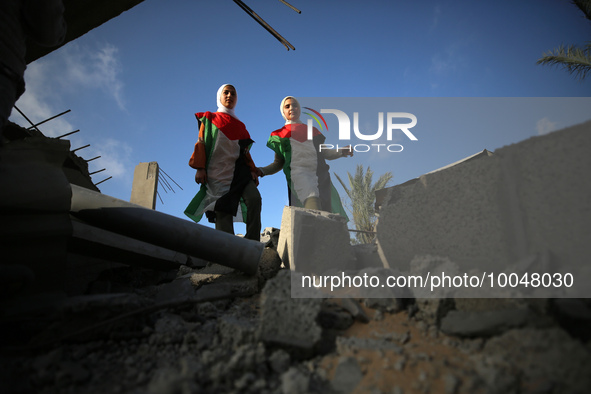 Palestinian children participate in an activity aimed to support the mental health of children affected by the recent Israel-Gaza fighting,...