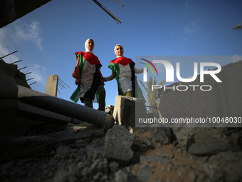 Palestinian children participate in an activity aimed to support the mental health of children affected by the recent Israel-Gaza fighting,...