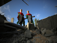 Palestinian children participate in an activity aimed to support the mental health of children affected by the recent Israel-Gaza fighting,...