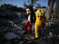 Palestinian children participate in an activity aimed to support the mental health of children affected by the recent Israel-Gaza fighting,...