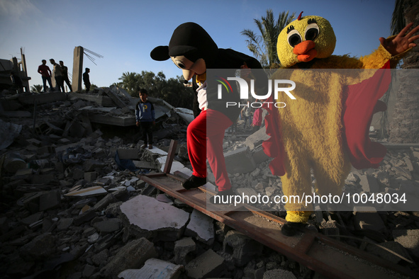 Palestinian children participate in an activity aimed to support the mental health of children affected by the recent Israel-Gaza fighting,...