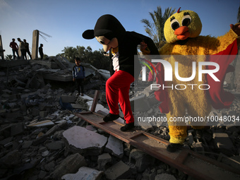 Palestinian children participate in an activity aimed to support the mental health of children affected by the recent Israel-Gaza fighting,...