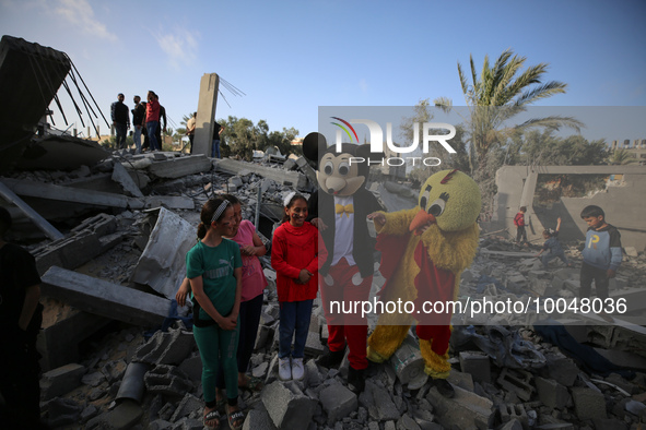 Palestinian children participate in an activity aimed to support the mental health of children affected by the recent Israel-Gaza fighting,...