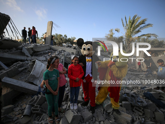 Palestinian children participate in an activity aimed to support the mental health of children affected by the recent Israel-Gaza fighting,...