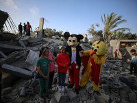 Palestinian children participate in an activity aimed to support the mental health of children affected by the recent Israel-Gaza fighting,...