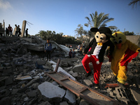 Palestinian children participate in an activity aimed to support the mental health of children affected by the recent Israel-Gaza fighting,...