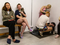 People hide in a shelter in a  residential building in Kyiv, the capital of Ukraine on May 16, 2023 as several powerful bomb blasts and fire...
