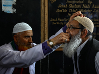 Kashmiri Muslims receive drops before leaving for Hajj during Hajj Vaccination program at SDH Sopore District Baramulla Jammu and Kashmir In...