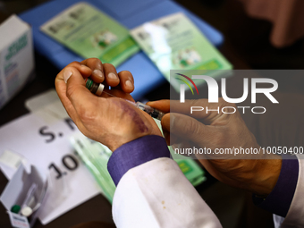 A health worker fills a Syringe with Vaccine during a Vaccination drive ahead of Hajj pilgrimage at SDH Sopore District Baramulla Jammu and...