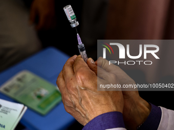 A health worker fills a Syringe with Vaccine during a Vaccination drive ahead of Hajj pilgrimage at SDH Sopore District Baramulla Jammu and...