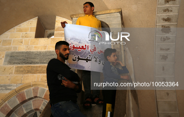 Palestinian protesters lift a banner during a rally against Israel and in support of Jerusalem's Al-Aqsa Mosque, during a rally in Gaza City...