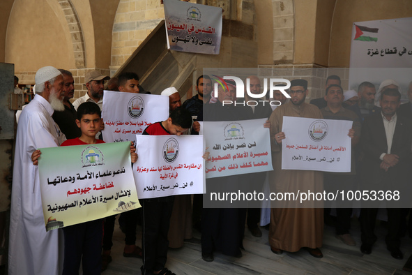 Palestinian protesters lift a banner during a rally against Israel and in support of Jerusalem's Al-Aqsa Mosque, during a rally in Gaza City...