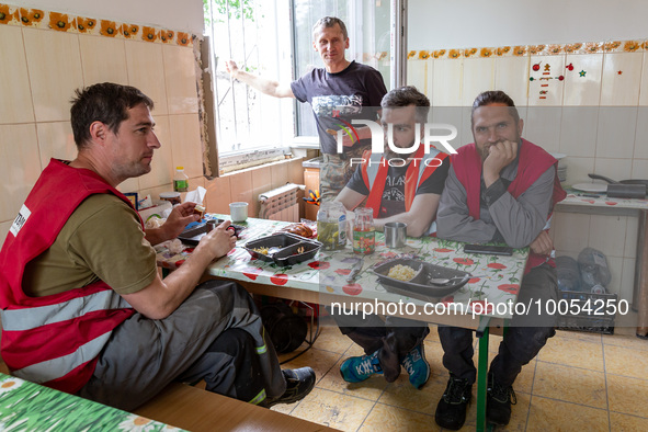 Volunteers from Gurtum foundation rest in the school which their NGO reconstructs after the building was damaged by at least 3 bombs in Host...