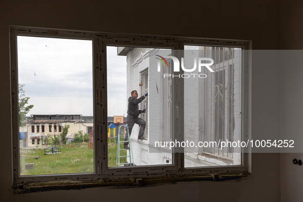 A volunteer from Gurtum foundation works in the school which his NGO reconstructs after the building was damaged by at least 3 bombs in Host...