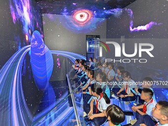 QINGZHOU, CHINA - MAY 23, 2023 - Primary school students experience the origin of the Earth at the Artificial Intelligence Learning Experien...