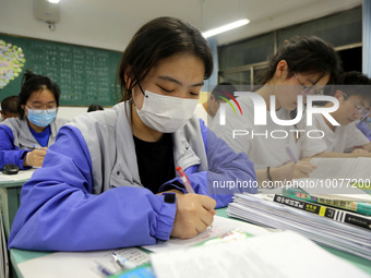  Students who are about to take the National College entrance examination (Gaokao) study in a classroom at Lianyungang Senior High School in...