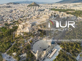 Aerial panoramic view from a drone of the Acropolis of Athens, a rocky outcrop above the city of Athens with many remains of several ancient...