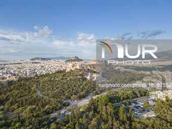 Aerial panoramic view from a drone of the Acropolis of Athens, a rocky outcrop above the city of Athens with many remains of several ancient...