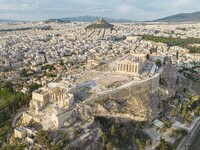 Aerial panoramic view from a drone of the Acropolis of Athens, a rocky outcrop above the city of Athens with many remains of several ancient...