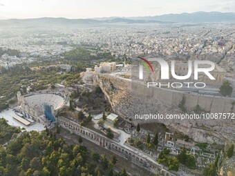 Aerial panoramic view from a drone of the Acropolis of Athens, a rocky outcrop above the city of Athens with many remains of several ancient...