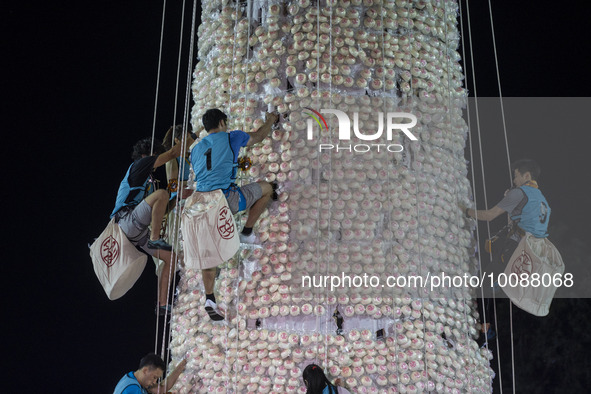 Participants participating in the Bun Scrambling Competition climbing the bun mountain on May 27, 2023 in Hong Kong, China. Cheung Chau Bun...