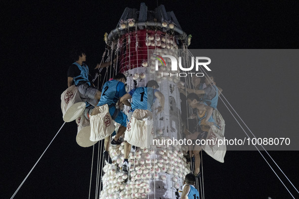 Participants participating in the Bun Scrambling Competition climbing the bun mountain on May 27, 2023 in Hong Kong, China. Cheung Chau Bun...