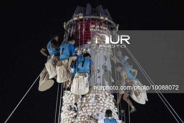 Participants participating in the Bun Scrambling Competition climbing the bun mountain on May 27, 2023 in Hong Kong, China. Cheung Chau Bun...