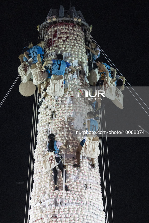 Participants participating in the Bun Scrambling Competition climbing the bun mountain on May 27, 2023 in Hong Kong, China. Cheung Chau Bun...