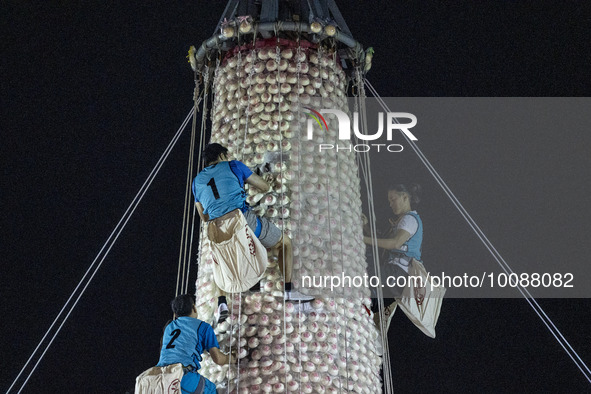 Participants participating in the Bun Scrambling Competition climbing the bun mountain on May 27, 2023 in Hong Kong, China. Cheung Chau Bun...