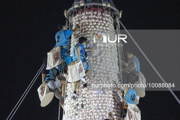 Participants participating in the Bun Scrambling Competition climbing the bun mountain on May 27, 2023 in Hong Kong, China. Cheung Chau Bun...