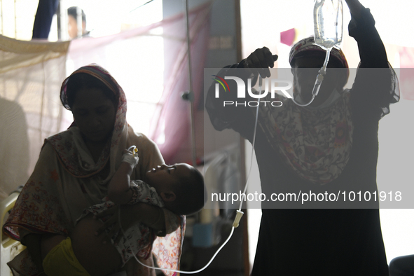 Al-Mahmud (3) is seen taking to the test lab for a blood test for dengue fever at a hospital in Dhaka, Bangladesh, on May 30, 2023. 
Accord...