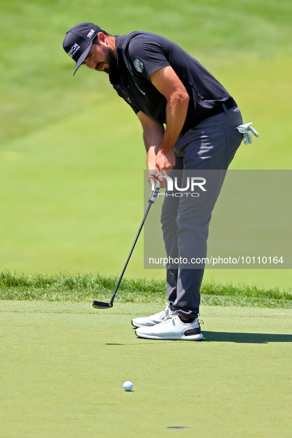 Mark Hubbard of Denver, Colorado putts on the 18th green during the first round of the The Memorial Tournament presented by Workday at Muirf...