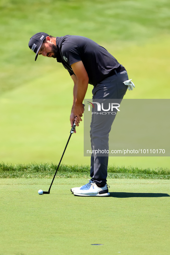 Mark Hubbard of Denver, Colorado putts on the 18th green during the first round of the The Memorial Tournament presented by Workday at Muirf...