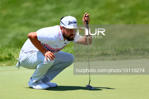 J.J. Spaun of Scottsdale, Arizona lines up his putt on the 18th green during the first round of the The Memorial Tournament presented by Wor...