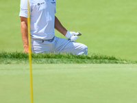 Kevin Kisner of Aiken, SC follows his chip from the sand trap onto the 18th green during the first round of the The Memorial Tournament pres...