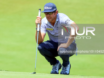 Lanto Griffin of Jacksonville Beach, Florida lines up his putt on the 18th green during the first round of the The Memorial Tournament prese...