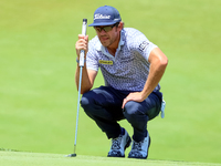 Lanto Griffin of Jacksonville Beach, Florida lines up his putt on the 18th green during the first round of the The Memorial Tournament prese...