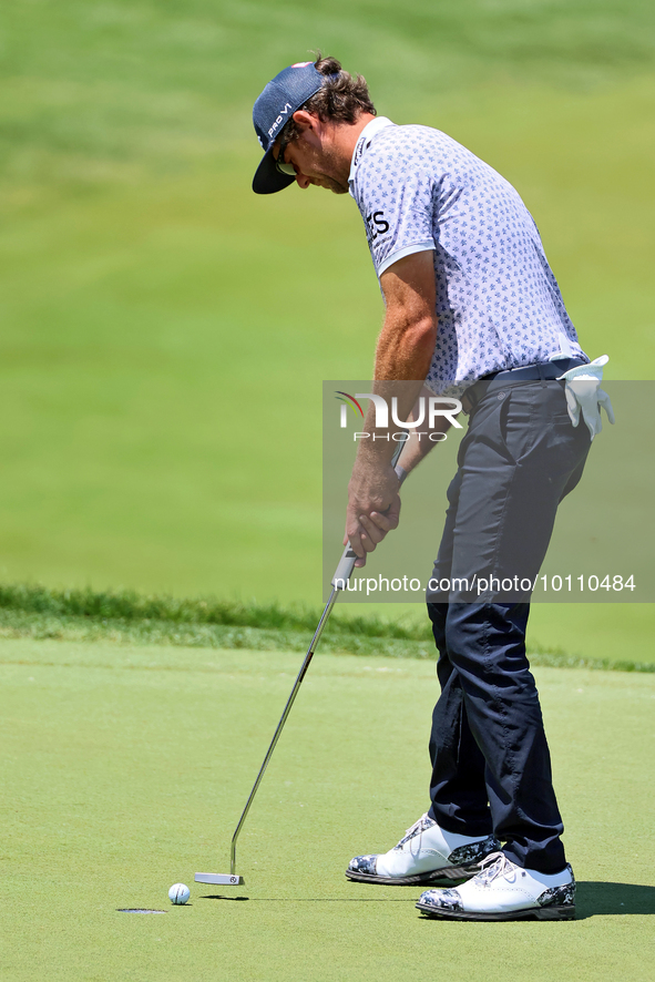 Lanto Griffin of Jacksonville Beach, Florida lines up his putt on the 18th green during the first round of the The Memorial Tournament prese...